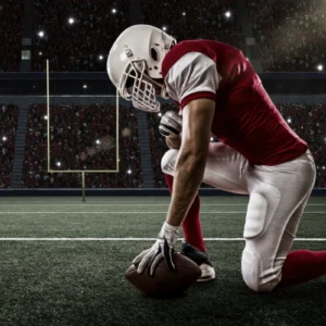 ToF Behang sport voetbalspeler met rood uniform op zijn knieën