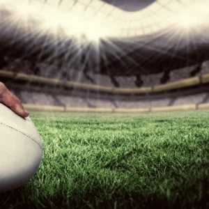 ToF Behang sport close-up van speler die bal tegen rugbyveld houdt
